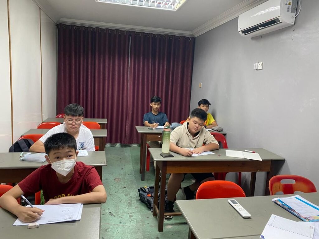 Teacher guiding primary students in classroom activity