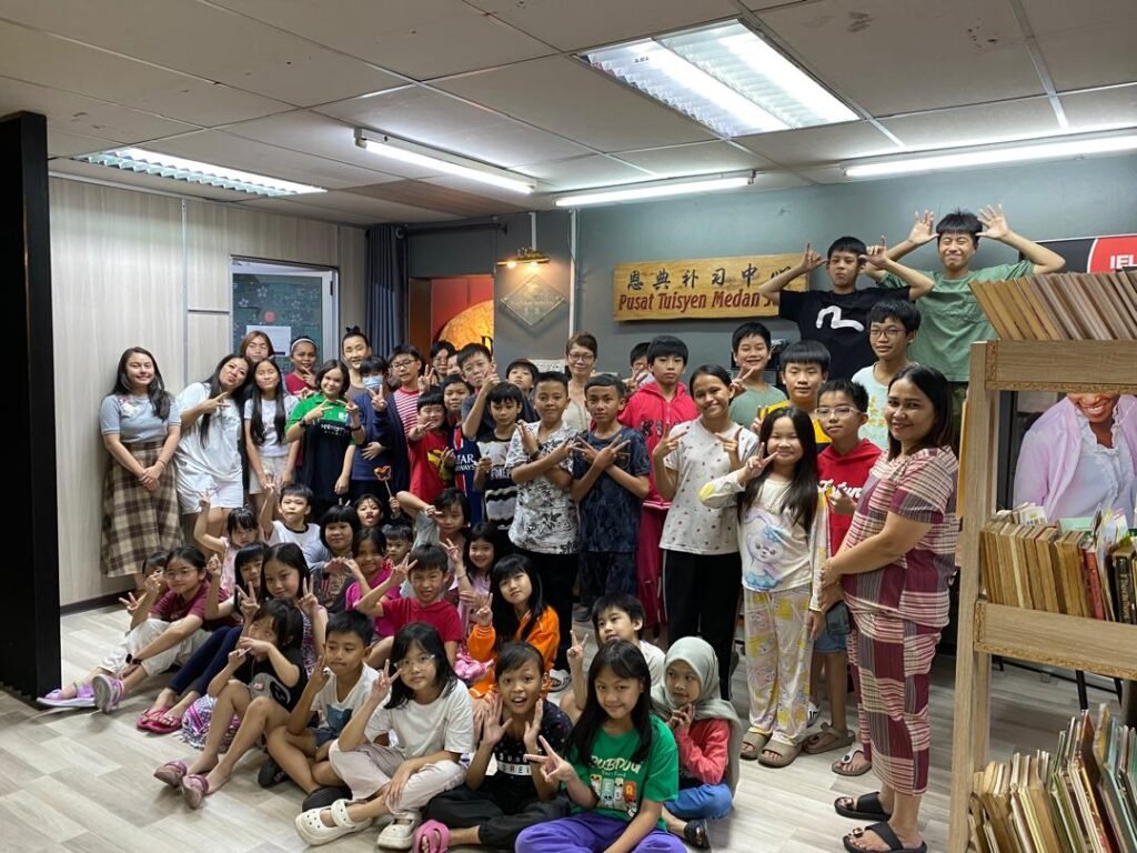 Photographer taking photo of primary students