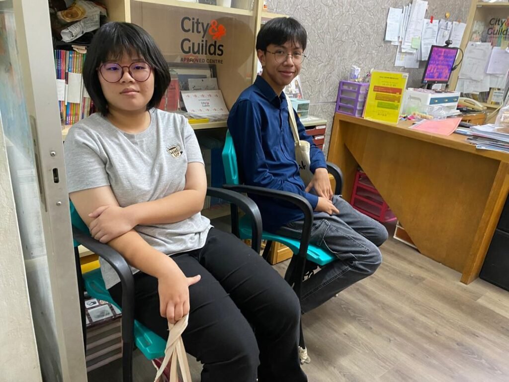 Students waiting outside classroom before lesson starts