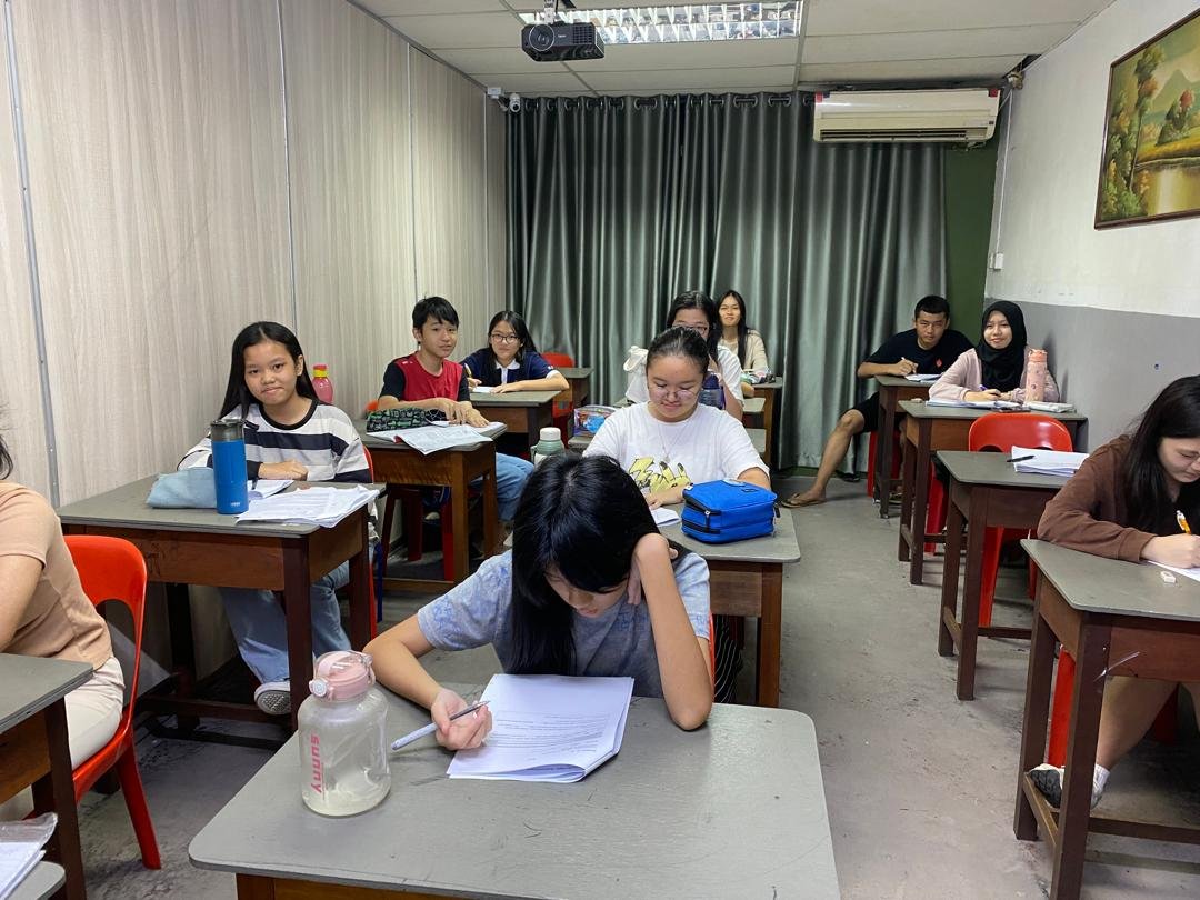 Group of secondary students engaged in classroom lesson
