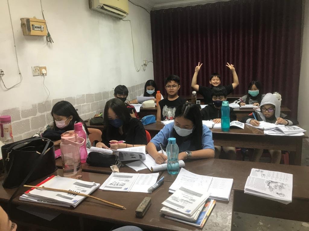 Happy primary students collaborating on group work