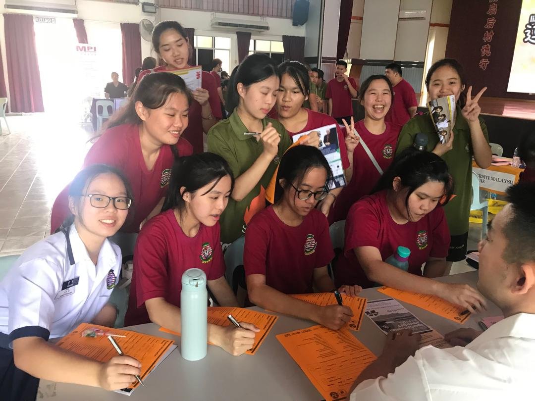 University admission booth busy with student inquiries