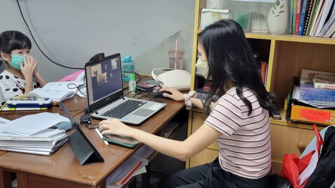 Junior students practicing English vocabulary