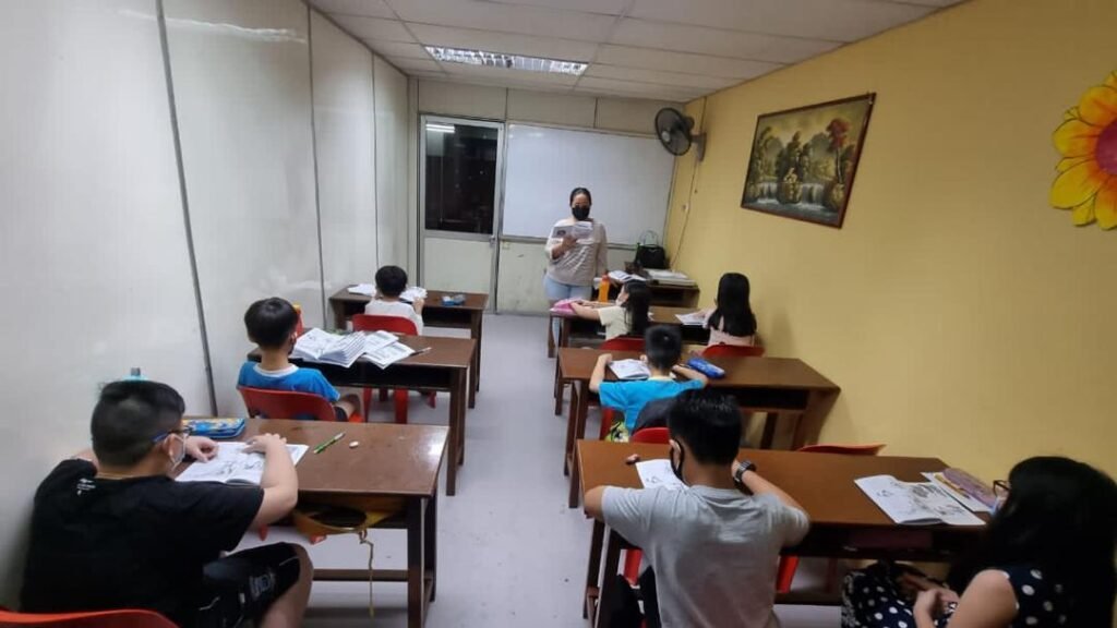 Students focused on lesson in small classroom group